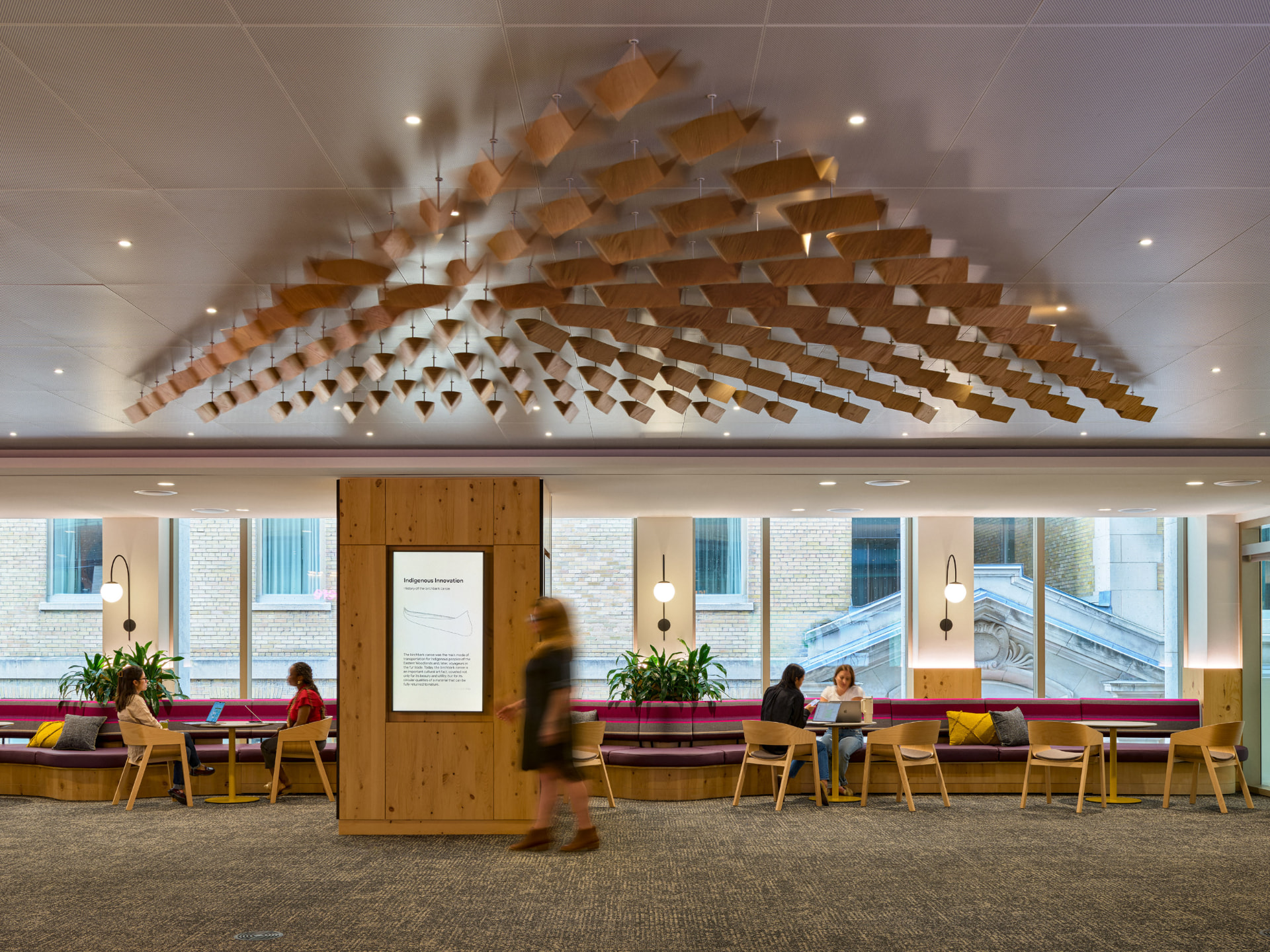 Suspended timber canopy over a workplace lounge
