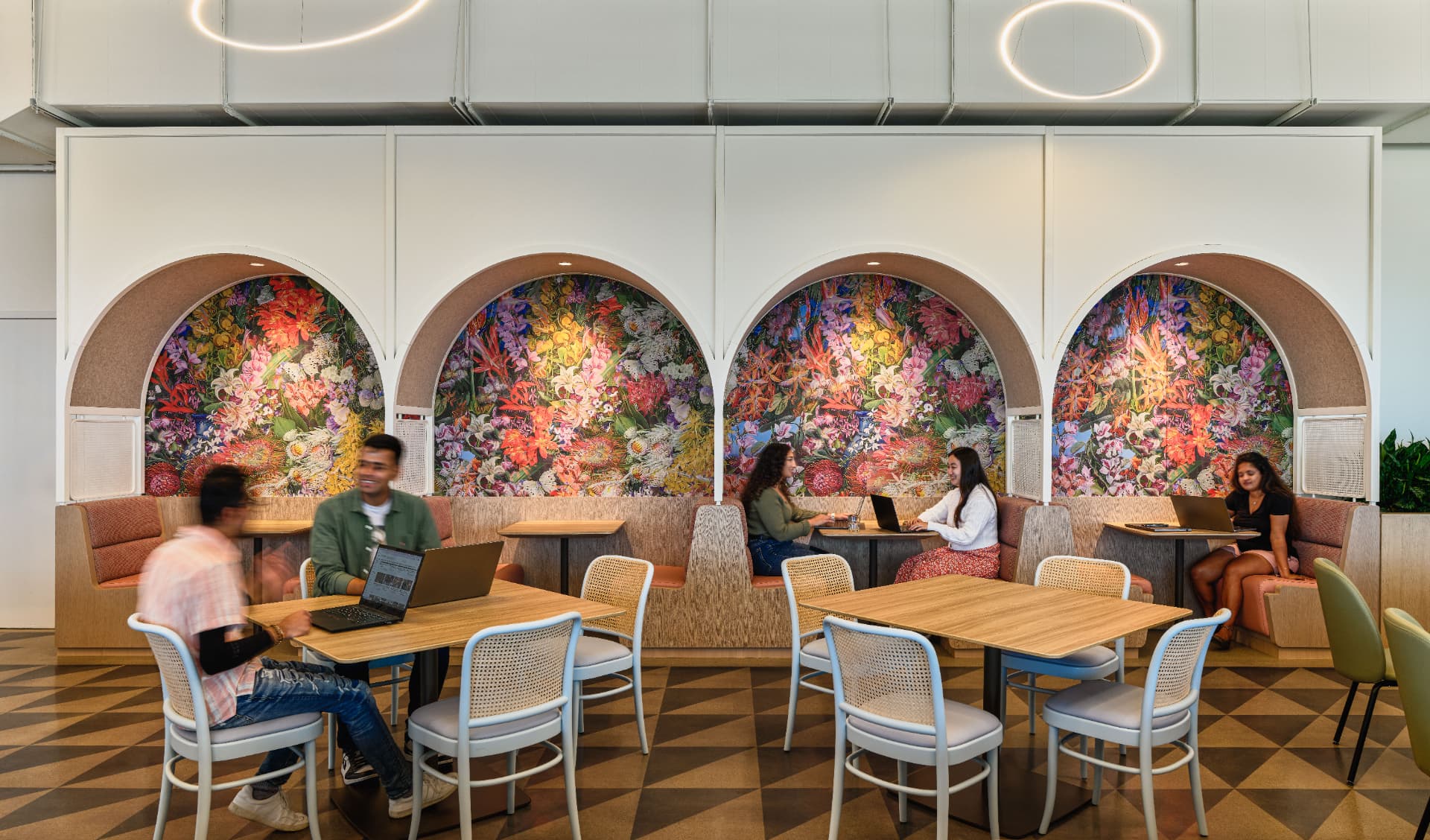 Café with arched floral booths