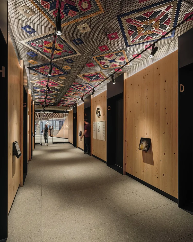 Timber corridor with woven patterned ceiling